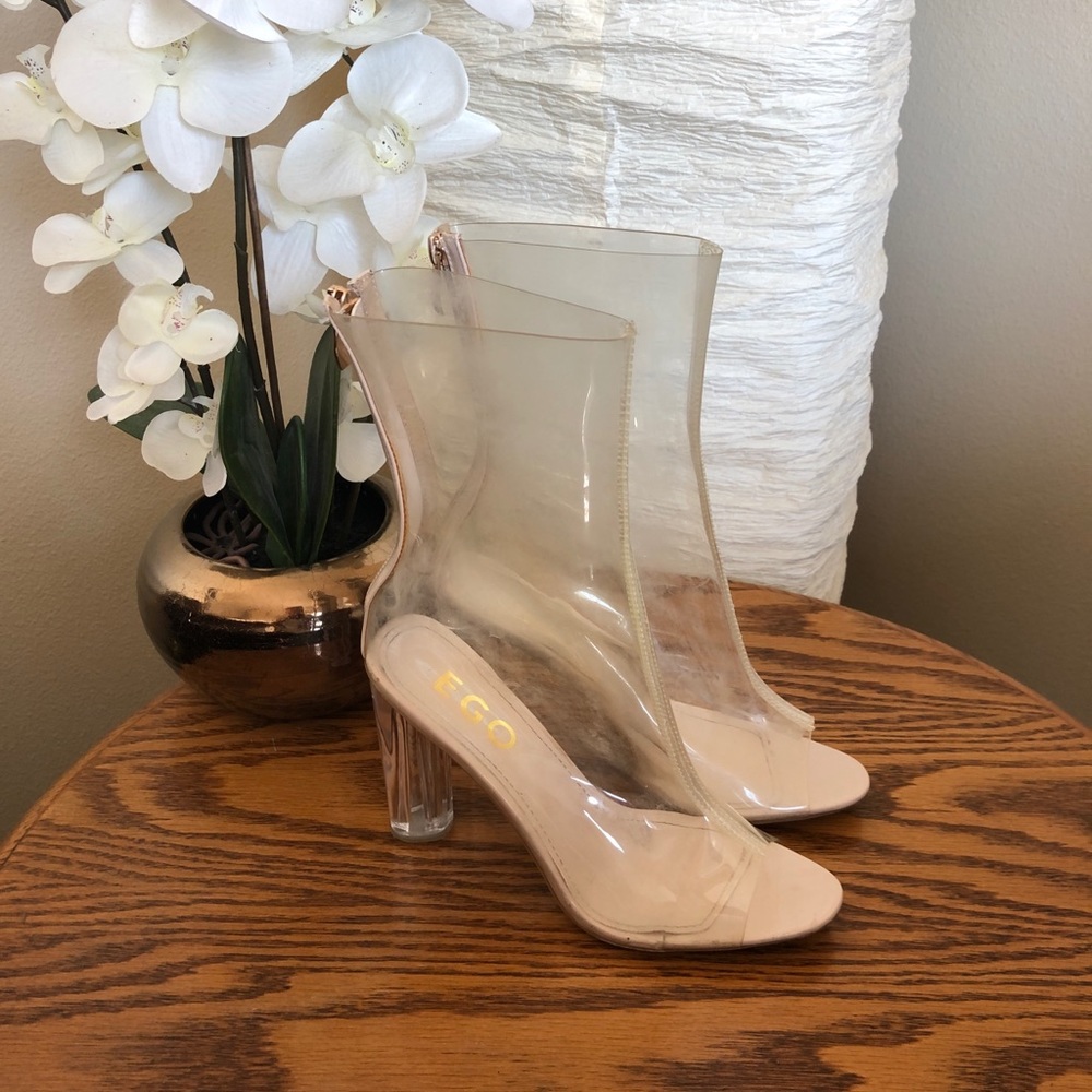 See through, open toed boots.